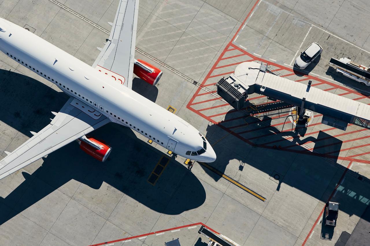 Photography of plane in an airport runway.